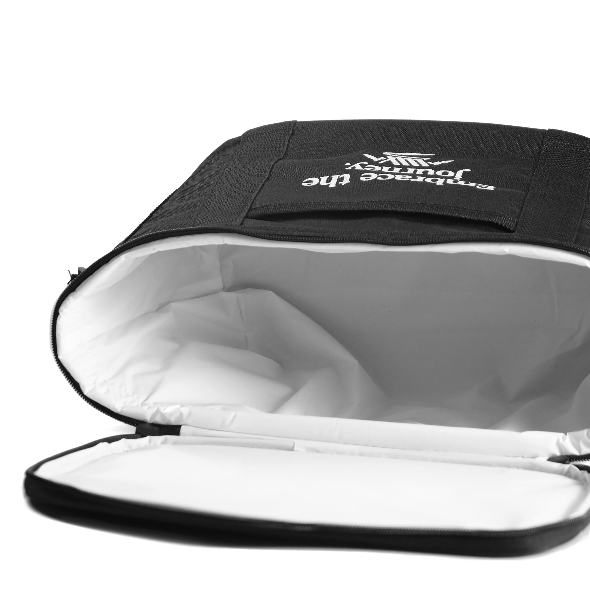 The LUXBMX Journey Cooler Bag is black with padded insulation, a zippered opening, and a spacious white interior. “Embrace the journey” is printed on the front pocket, and it includes an adjustable shoulder strap for easy carrying.