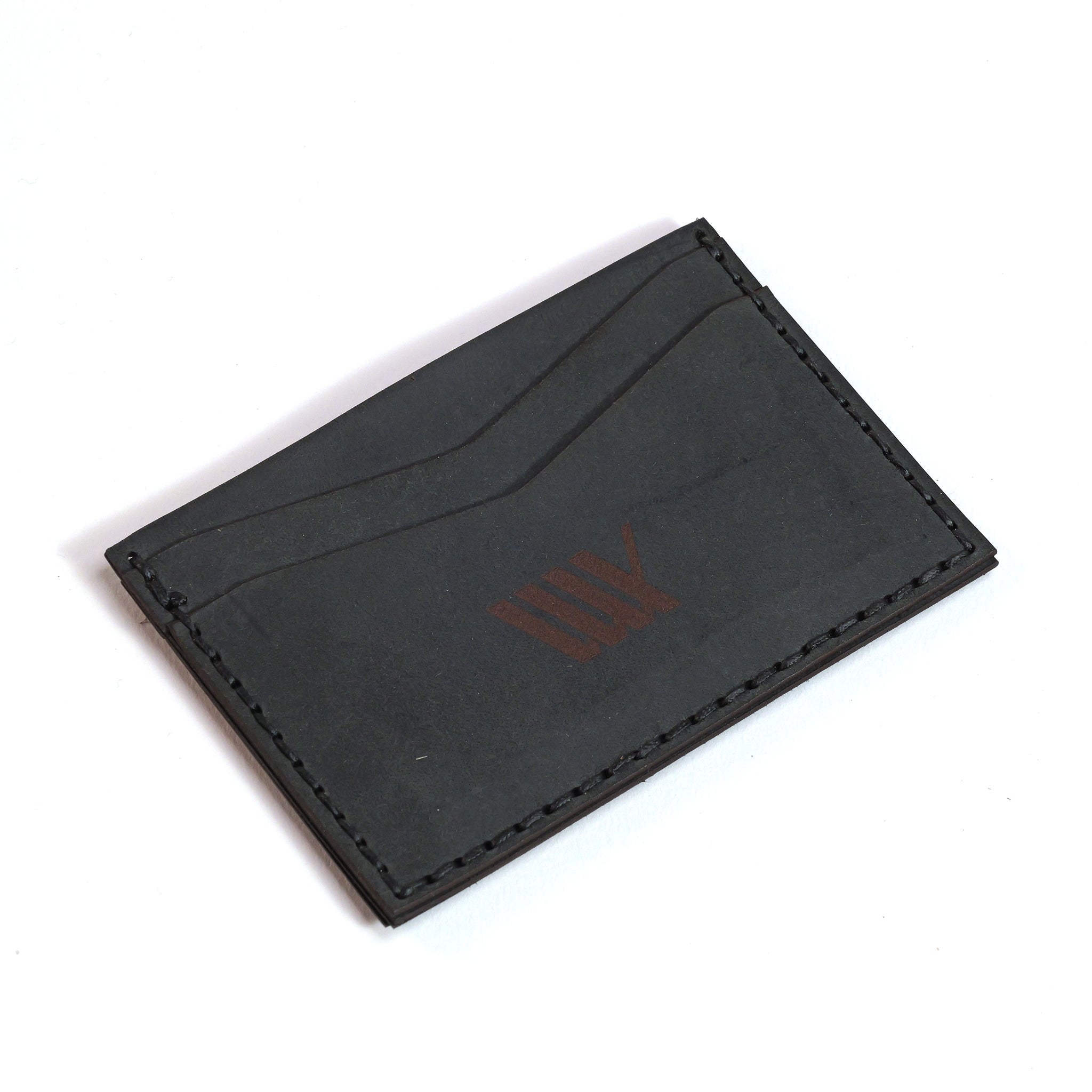 The LUXBMX Leather Card Holder is a handmade leather accessory with two card slots, visible stitching, and a subtle front logo—perfect for anyone who values quality craftsmanship.