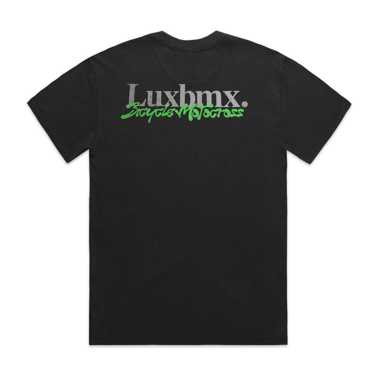The LUXBMX Slime Time Tee in faded black features "Luxbmx. Bicycle Motocross" text in white and green on the back, emanating a nostalgic 90s vibe.