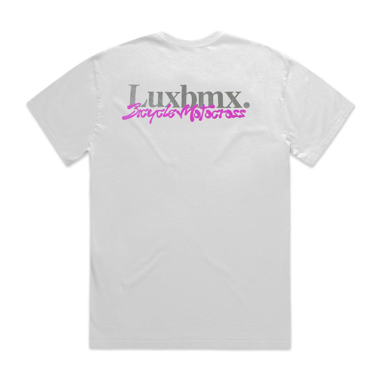 The LUXBMX Slime Time Tee in Faded White is a heavyweight shirt showcasing "Luxbmx." in gray and "Bicycle Motocross" in pink on the back, offering a distinct 90s vibe.