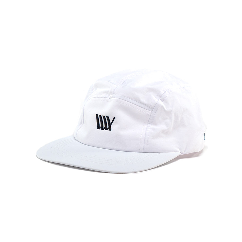 A LUXBMX X IK Aero 5 Panel Cap - White with a LUXBMX logo on it.