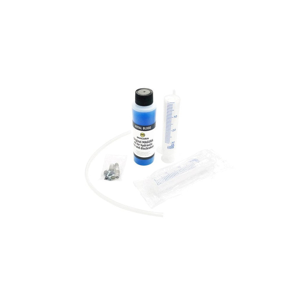 A bottle labeled "Magura Bleed Kit," a syringe, clear tubing, and small components spread out on a white background.