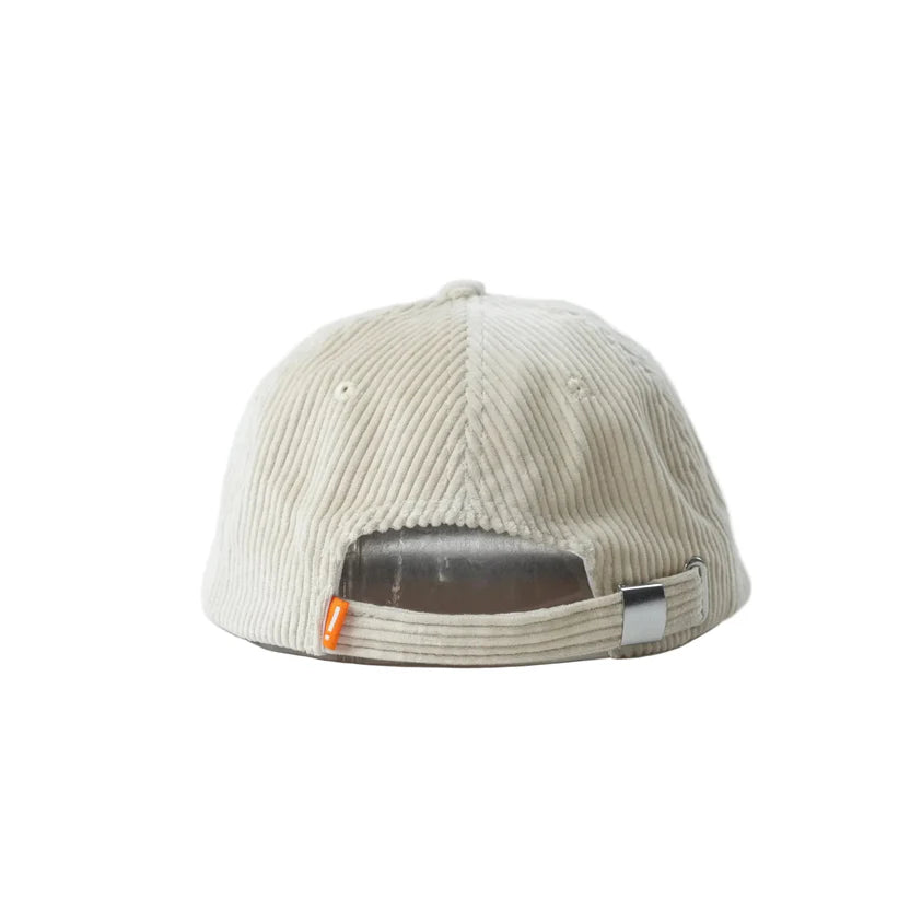 Mahd Botanical Corduroy Hat in beige, shown from the back with an adjustable strap and metal buckle—ideal for upgrading your style, inspired by Boyd Hilder’s signature cords look.