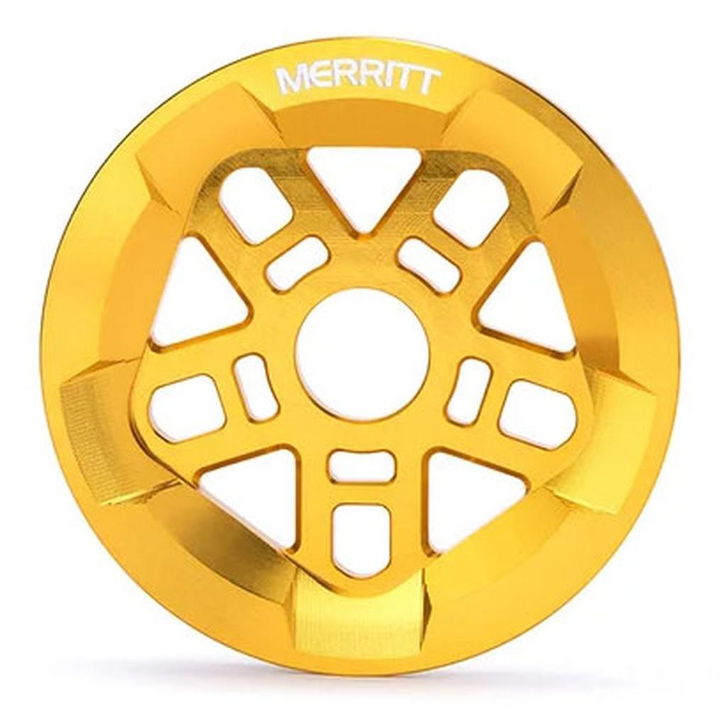 A golden Merritt Brandon Begin Guard Sprocket with cutout patterns, featuring the brand name "Merritt Brandon Begin Guard Sprockets" engraved at the center.