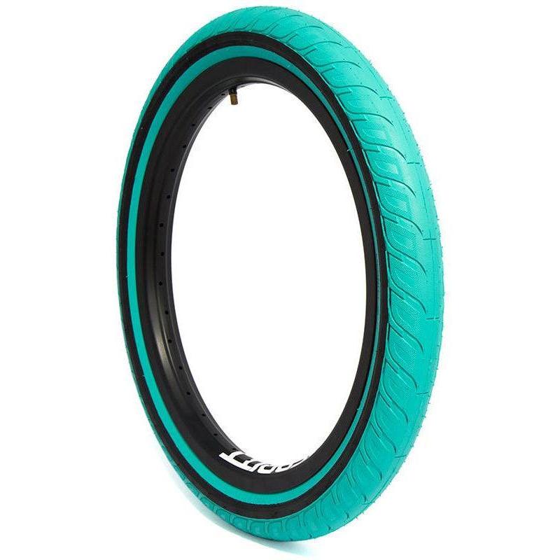 A teal-colored Merritt Option 20 Inch Tyre (Each) featuring Slidewall Technology with a black inner rim, shown standing upright against a white background.