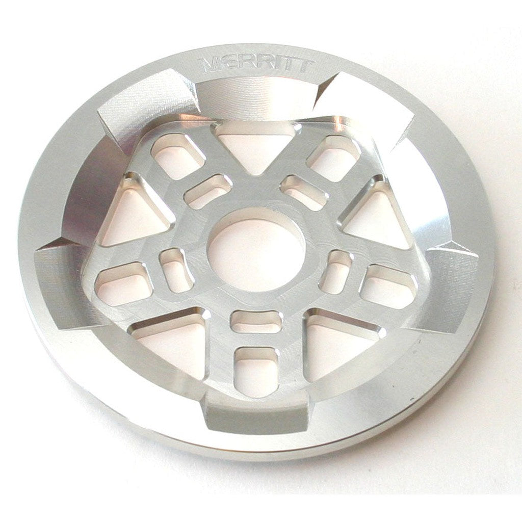 A metal Merritt Brandon Begin Guard Sprocket with triangular and rectangular cutouts, and the brand name engraved at the top.
