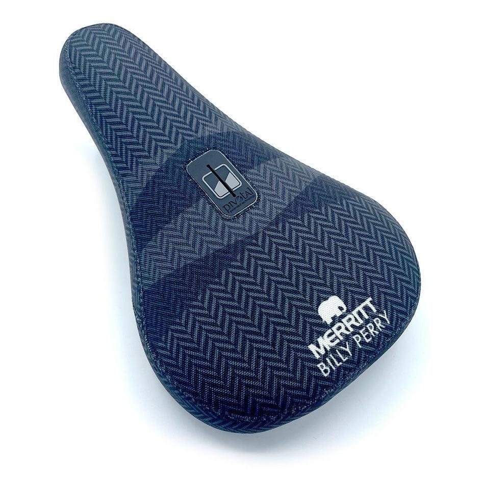 The Merritt Billy Perry Pivotal Seat features a blue herringbone canvas cover, white Merritt logo, and "Billy Perry" text for stylish durability—perfect for any BMX rider seeking the Billy Perry Signature look.