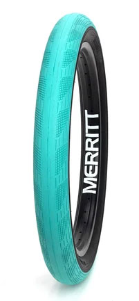 A teal-colored Merritt Phantom Tyre standing upright against a white background.