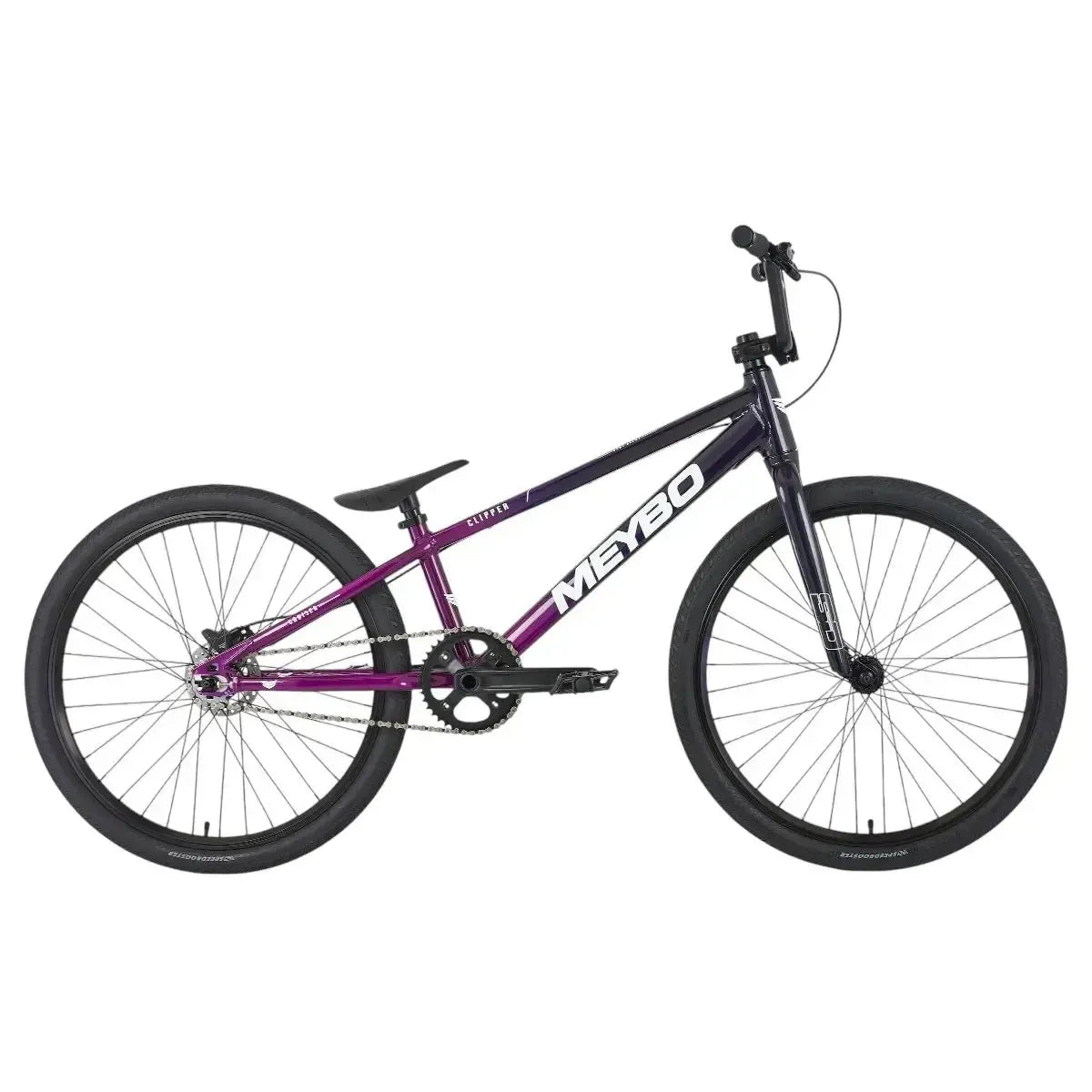 The Meybo 2025 Clipper Pro Cruiser Bike features a striking purple and black frame with large tires and a compact seat. Perfect for entry-level racing, it ensures smooth stops with its advanced hydraulic disc brakes.