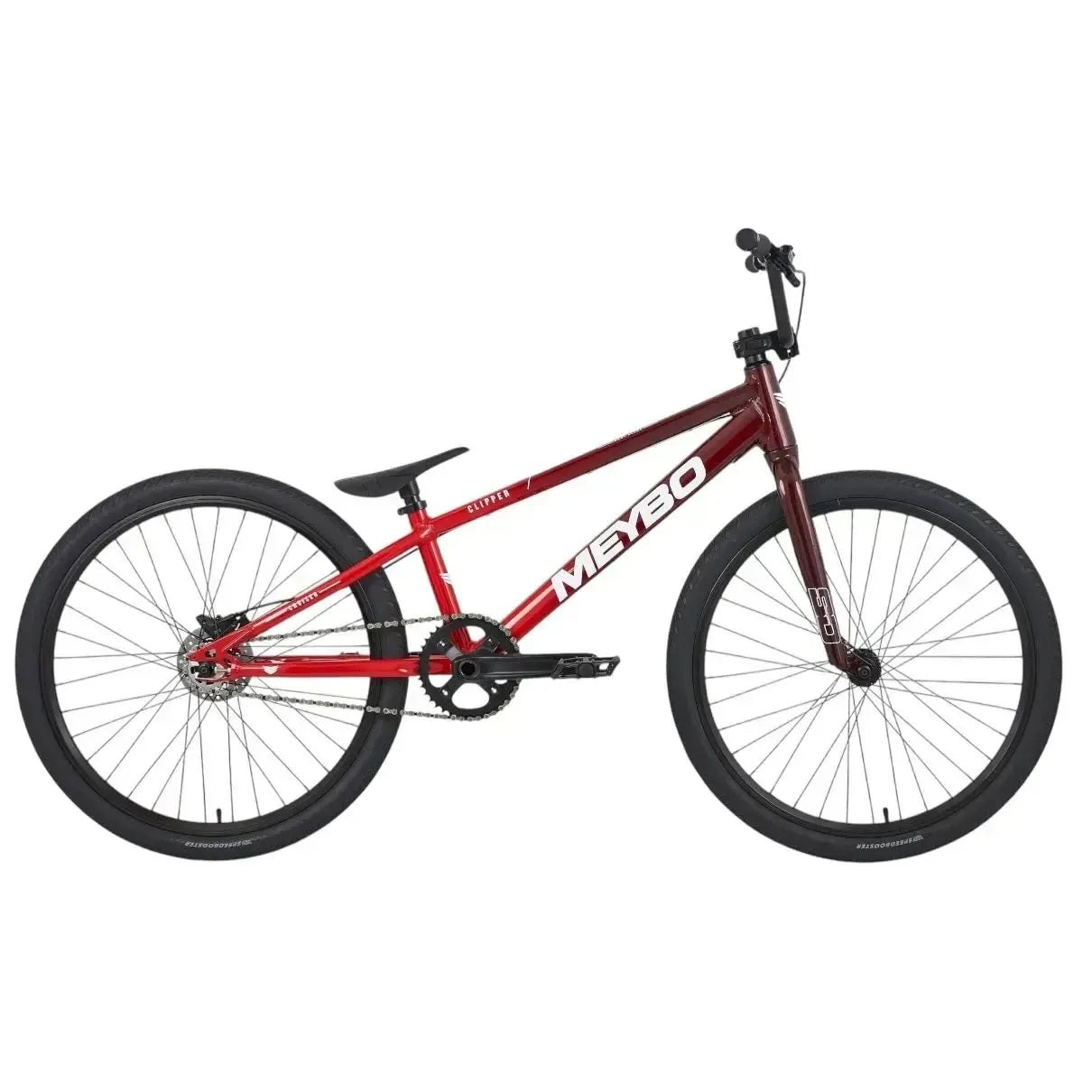 The Meybo 2025 Clipper Pro Cruiser Bike is a striking red BMX ideal for entry-level racers, featuring a black saddle, handlebars, and tires set against a white backdrop.
