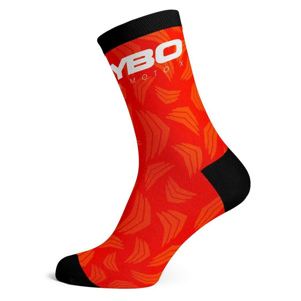 The Meybo Sock Ribbed Crew Sock is bright orange with black heel, toe, and cuff. It features a white "YBO" logo and lighter orange angular patterns—ideal for racing or making a statement on the dance floor.
