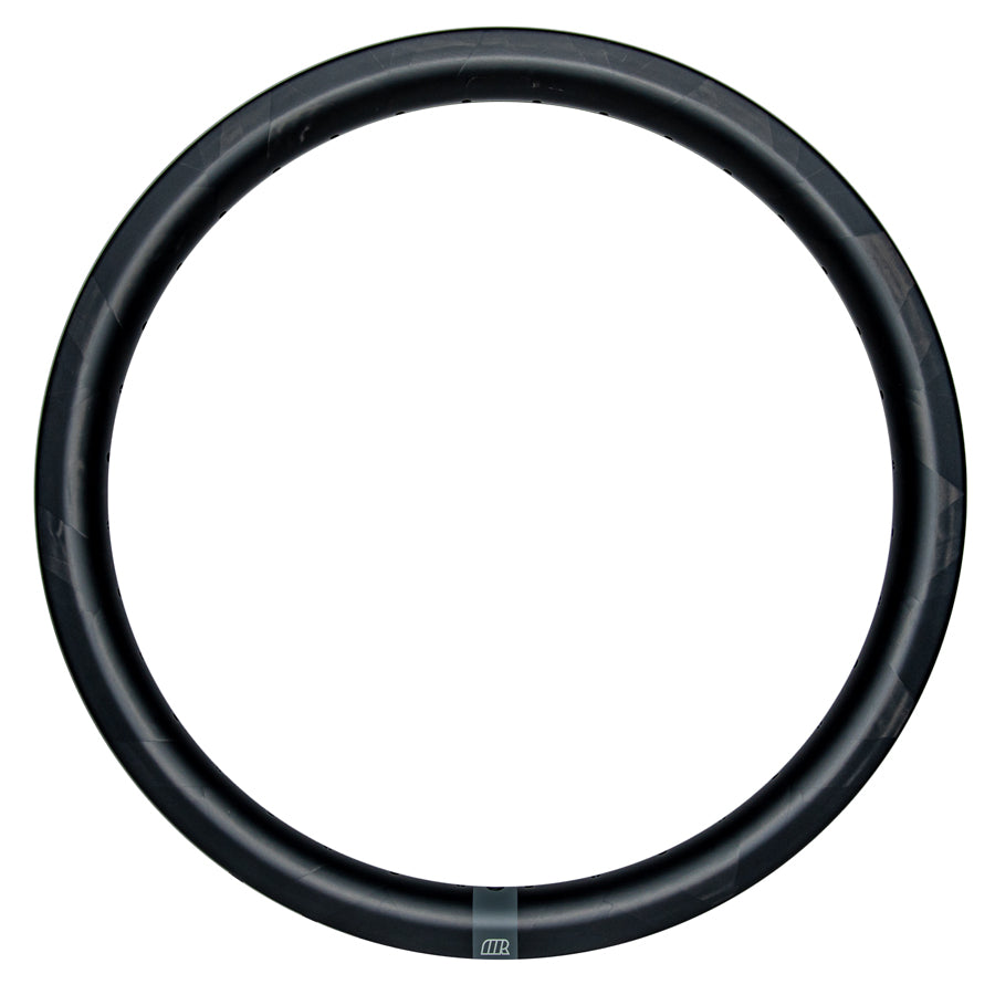 The Michram OWT Carbon Rim Plain Logo (28 Hole) is a sleek black circular BMX race rim on a white background, highlighting its hand-woven T800 carbon fiber craftsmanship, offering lightweight strength, performance, and style in every spin.