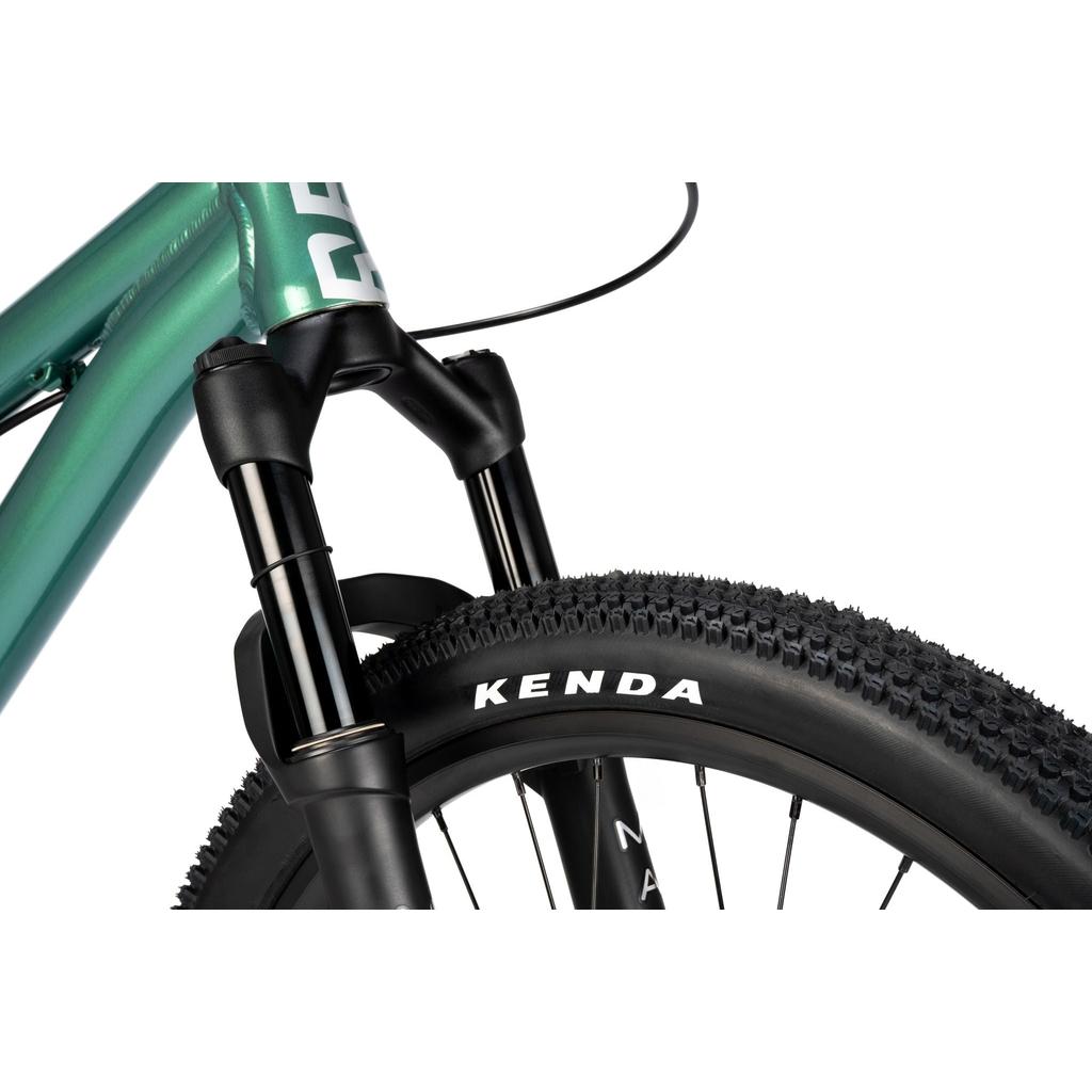 Close-up of the Radio Griffin 24 Inch Dirt Jumper Bike's front suspension fork and Kenda tire, highlighting the tread pattern and a section of the bike frame.