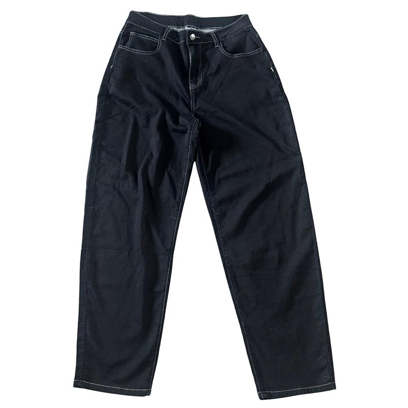 The Monticule Flow Pants by Max Miller are black baggy-fit denim jeans with white stitching, inspired by classic BMX pants. They feature front pockets and a button closure, shown laid flat on a white background.