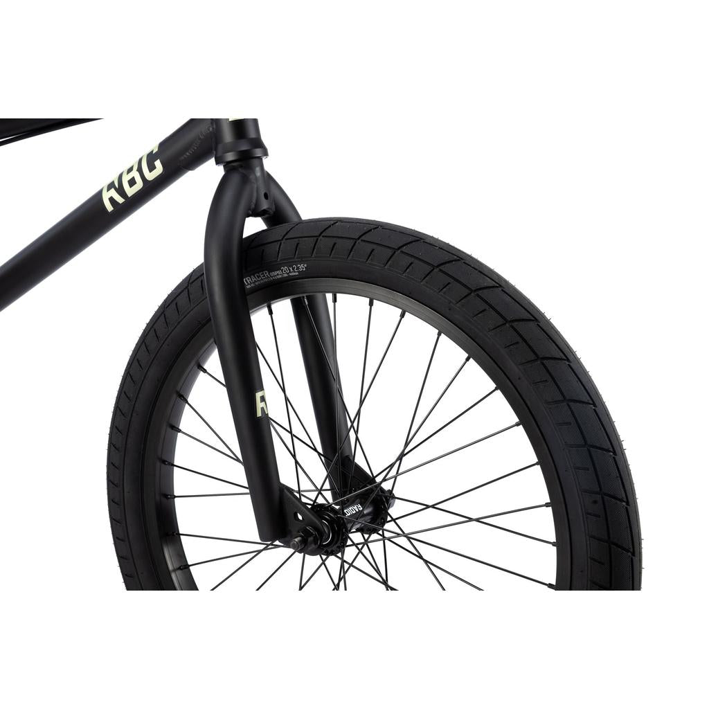 Close-up of a black Radio Evol XL 20 Inch Bike front wheel, highlighting the tire, spokes, fork, and partial frame—showcasing key features of this entry-level BMX model.