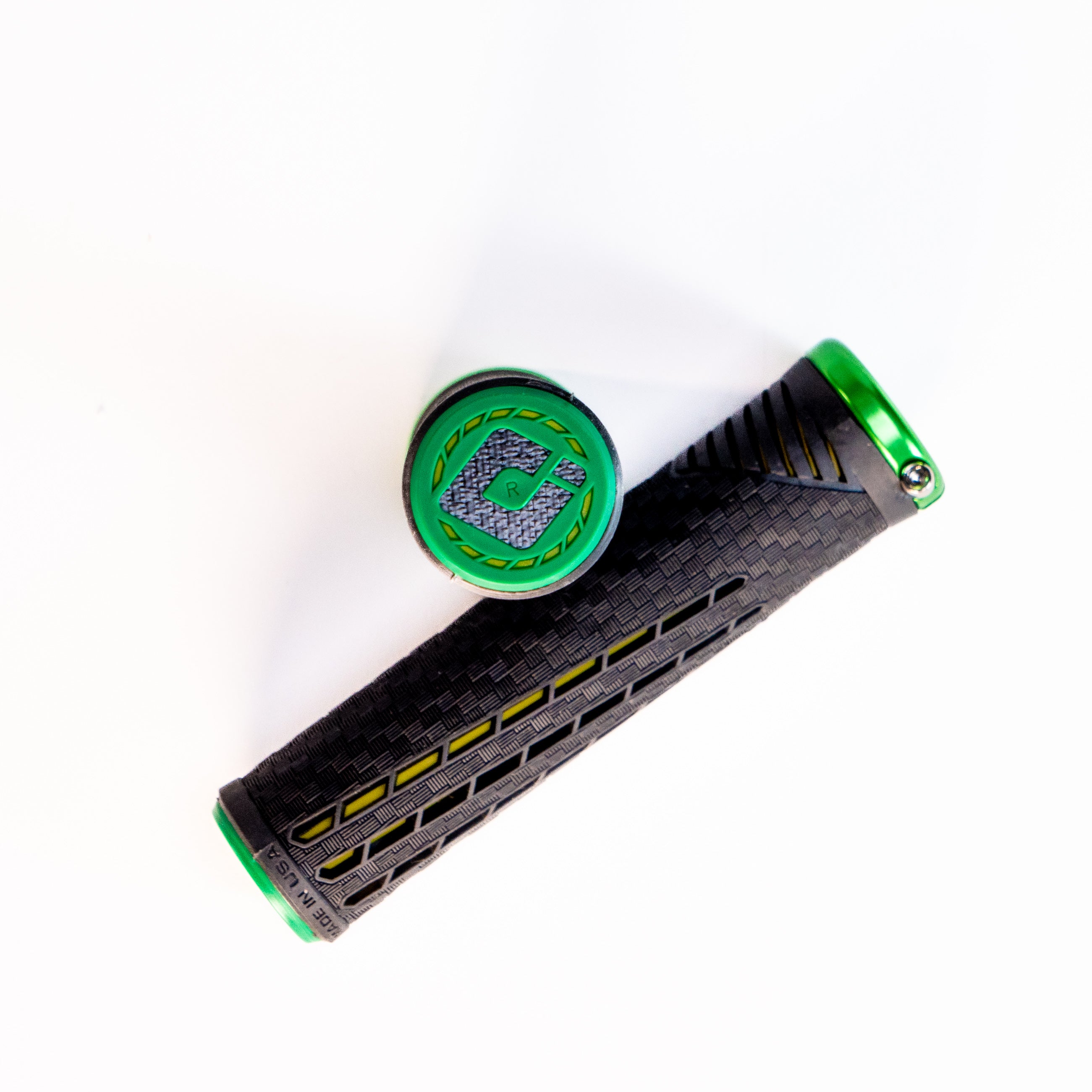ODI CF Lock On Grips V2.1 Izaac Kennedy Signature in black and green with a textured surface, displayed against a white background. This Australian exclusive handlebar grip is designed for champions.