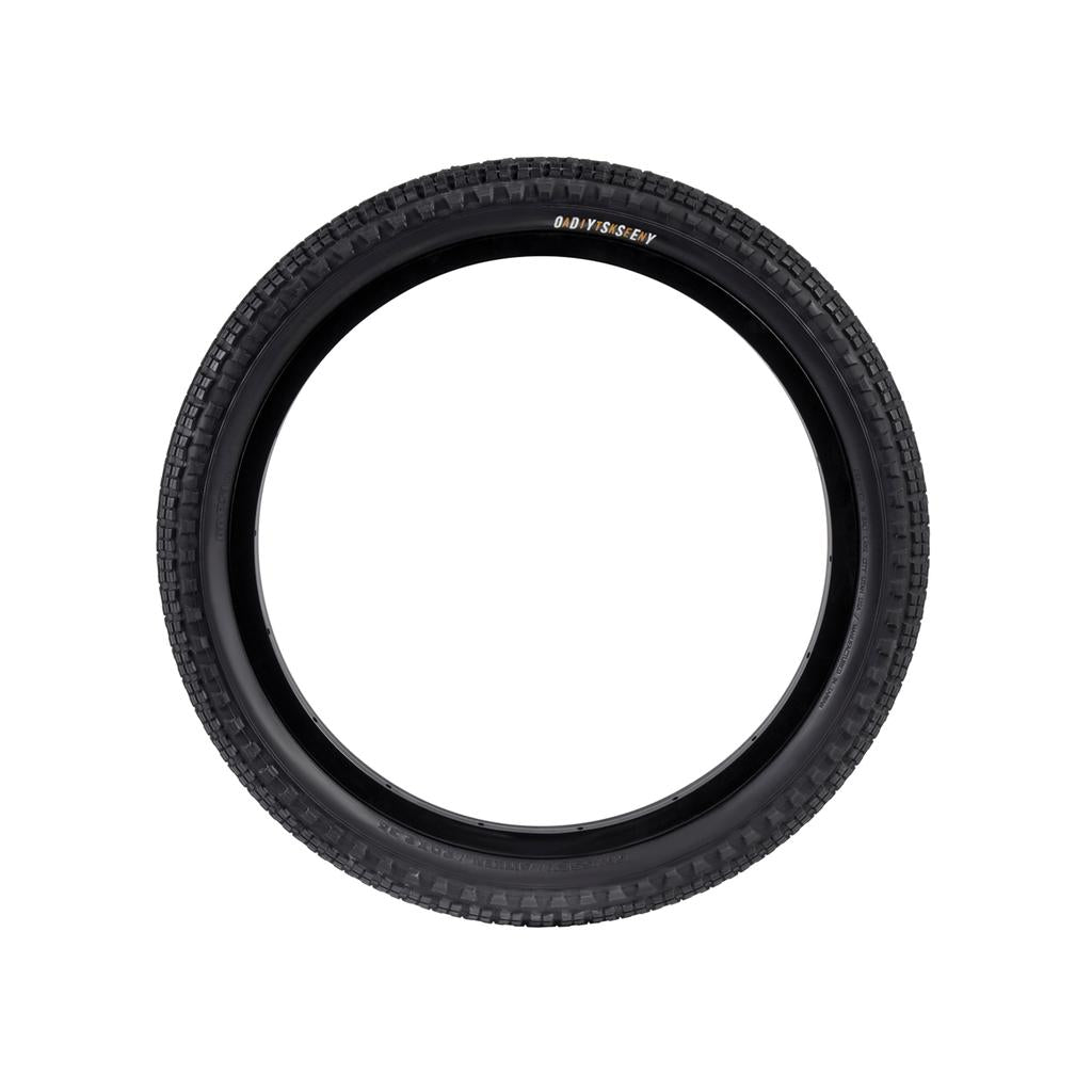The Odyssey Aitken Knobby Tyre, with a black knobby tread pattern and fast-rolling center, is seen from the side on a plain white background.