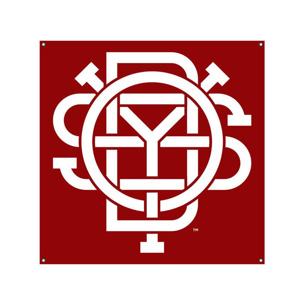 The Odyssey Monogram Banner features a weather-resistant white geometric pattern of interconnected lines and shapes on a red square background, making it perfect for your BMX setup.