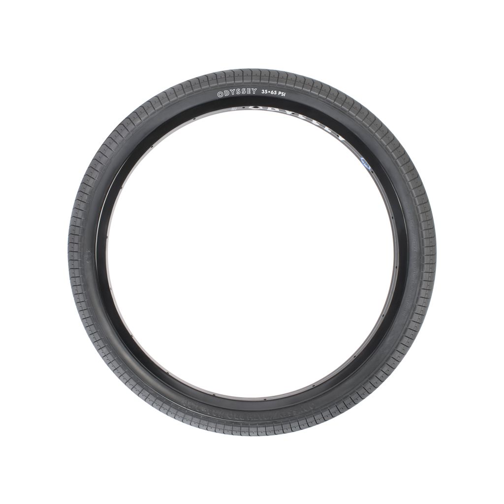 A black bicycle tire with a treaded pattern, designed using a proprietary rubber compound for superior grip. The branding "Odyssey Path Pro 24 Inch Tyre" is visible on the side.