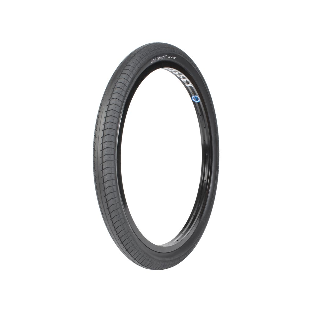 Bicycle tyre with a black rubber surface and a detailed tread pattern, shown against a white background. The Odyssey Path Pro 24 Inch Tyre features a proprietary rubber compound for superior grip on various terrains.