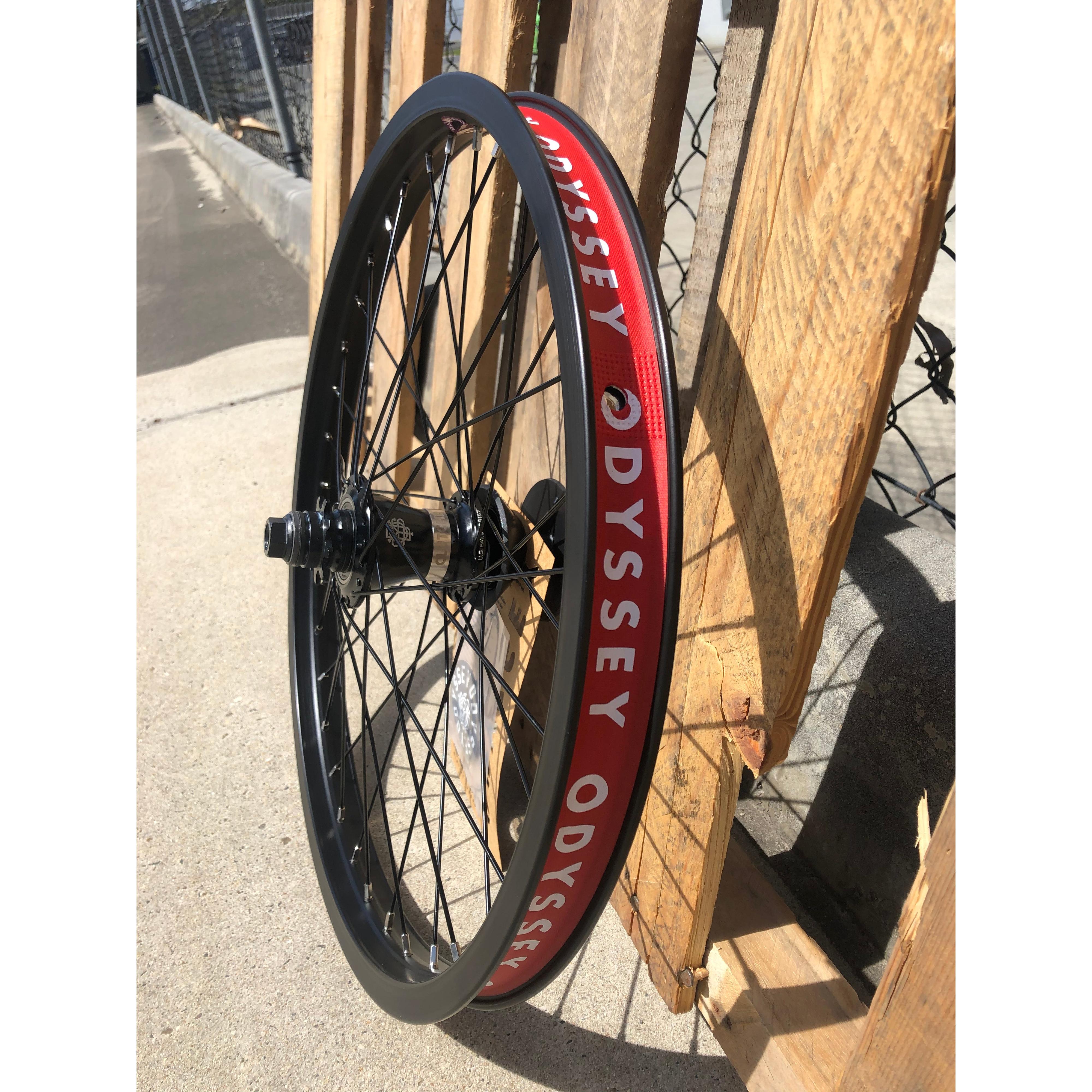 A rim with the Odyssey Quadrant X Clutch V2 Rear Wheel written on it.