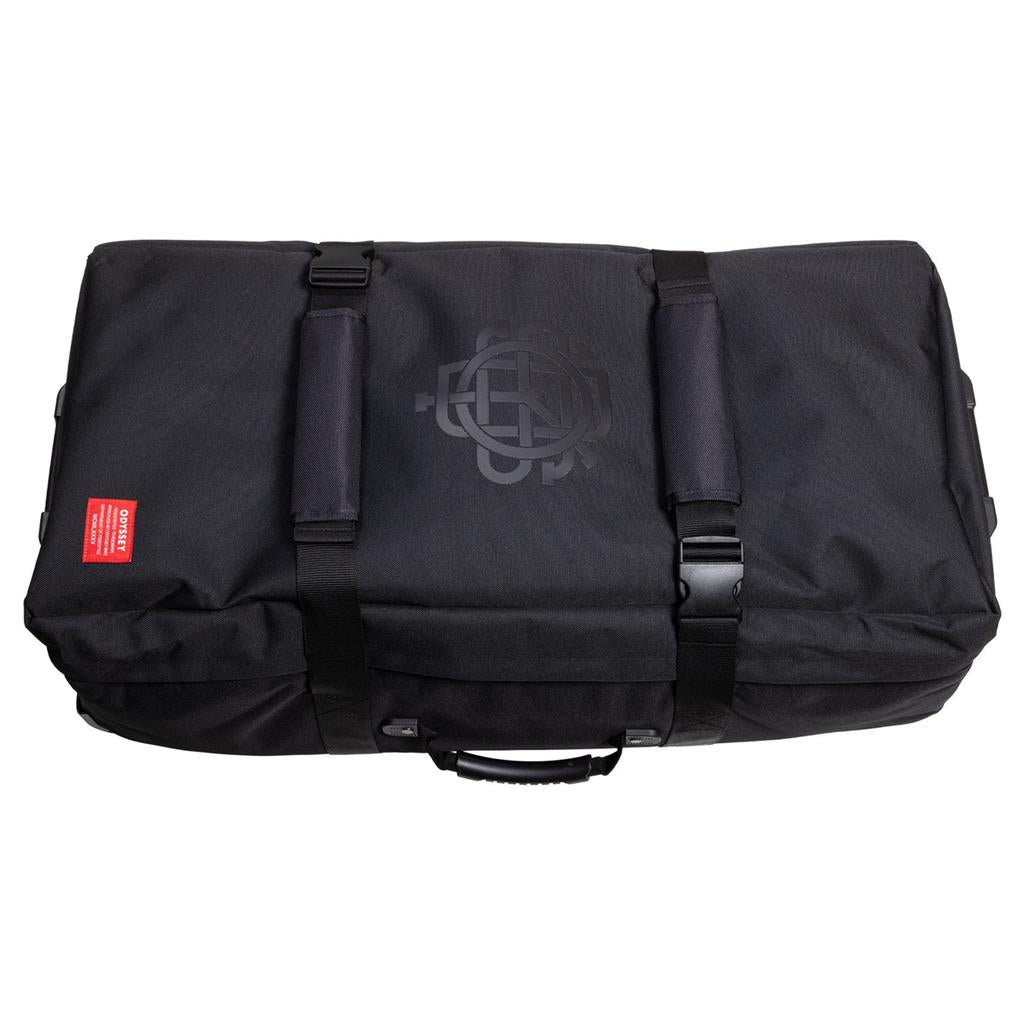 The Odyssey Traveler Pro Bike Bag is a large black duffel with black straps, handle, buckle closure, top logo, and a small red and white side label. Ideal as a BMX bike bag.