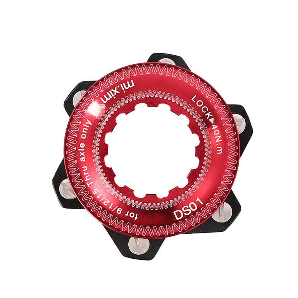 The Position One Centerlock ISO Adapter Kit features a red-anodized aluminum bicycle lockring adorned with a zigzag pattern. It is marked with specifications including "DS01," "LOCK," and measurements around 41 mm, and is compatible as a center lock adapter for 6-bolt rotors.