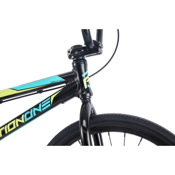 A durable black and blue Position One Expert Bike (2024) with an aluminum frame showcased against a white background.