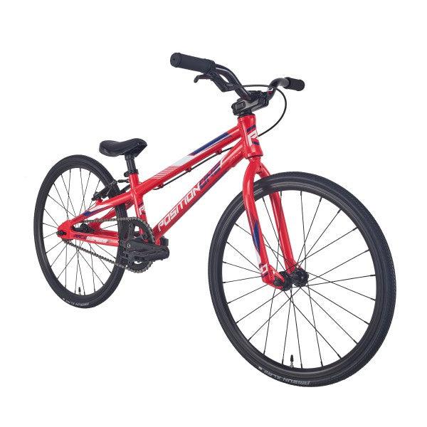 A red Position One Mini Bike (2024) with an aluminium frame on a white background.