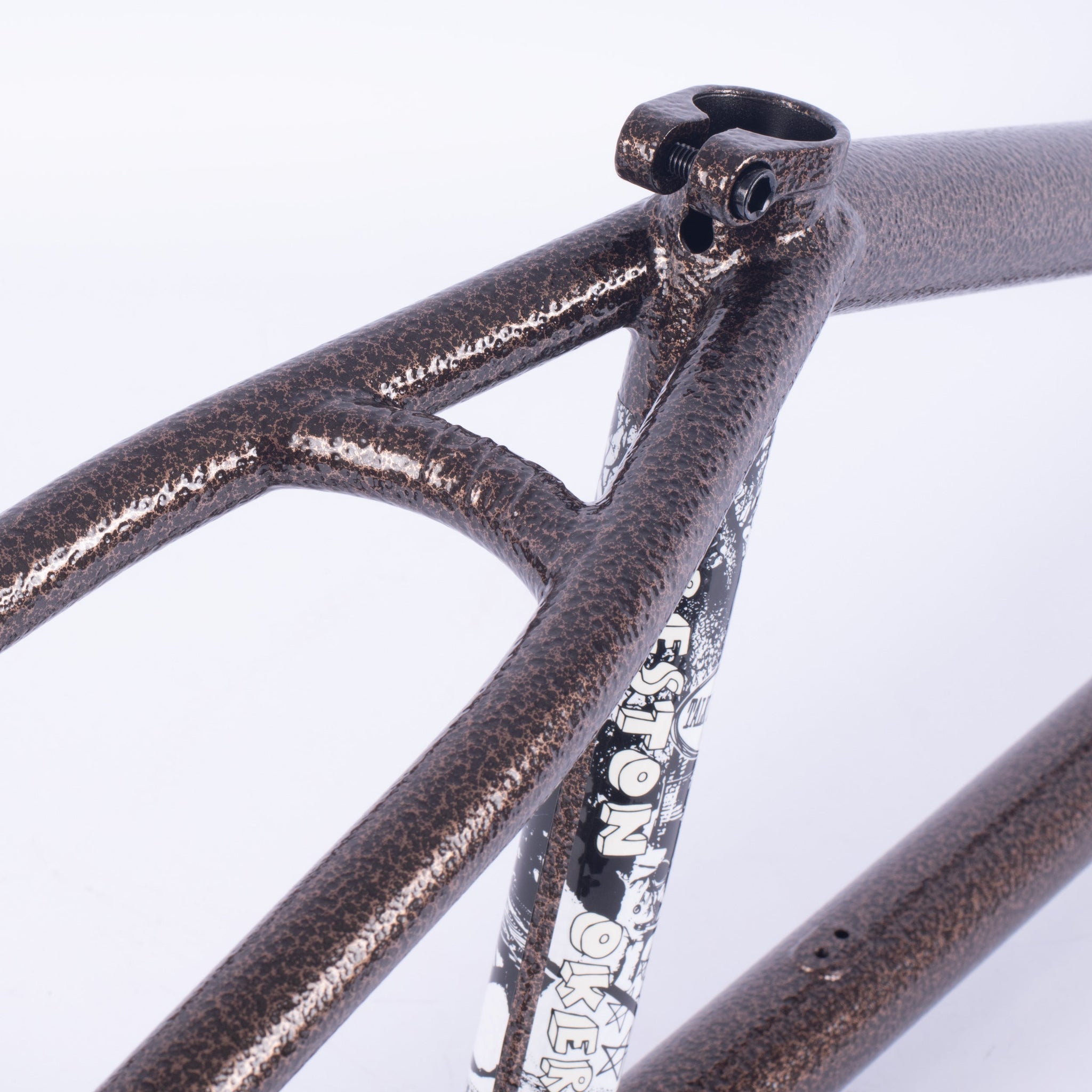 Close-up of the metallic brown Cult Walsh Frame (Preston Okert Signature), highlighting the seat tube, seat stay, and top tube with a graphic sticker on the seat tube inspired by Preston Okert’s design.