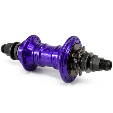 The Profile Mini Rear Cassette Hub, available in purple with black hardware, features a low-flange design with intricate grooves and threaded ends. It's an ideal choice for BMX enthusiasts who prioritize both durability and style.