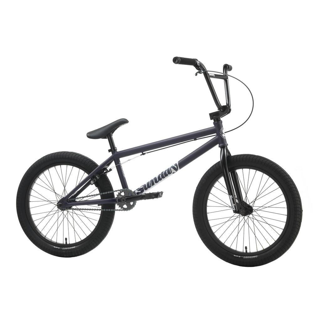 The Sunday Primer 20 Inch Bike, featuring a black frame, thick tires, a straight top tube, and raised handlebars, is shown in profile against a white background.