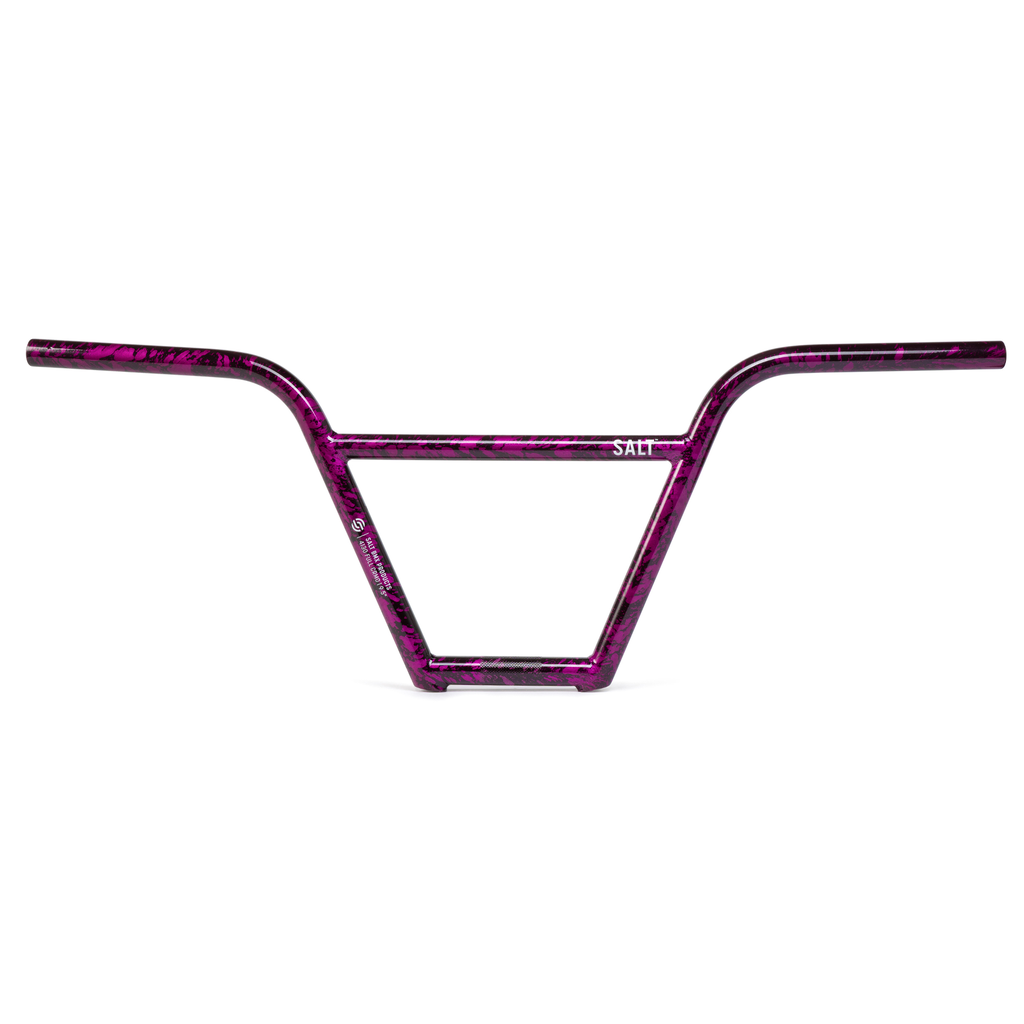 A purple bike handlebar with a pink pattern featuring Salt Pro 4 Piece Bars.