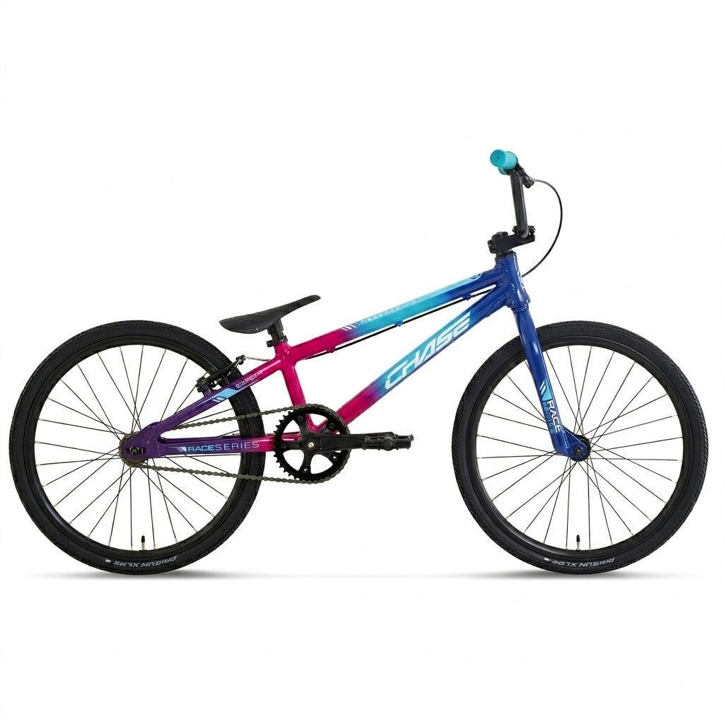 A Chase Race Series Expert Race Bike (2027) featuring a gradient frame in purple, pink, and blue, with black tires and a black seat, is shown on a white background.