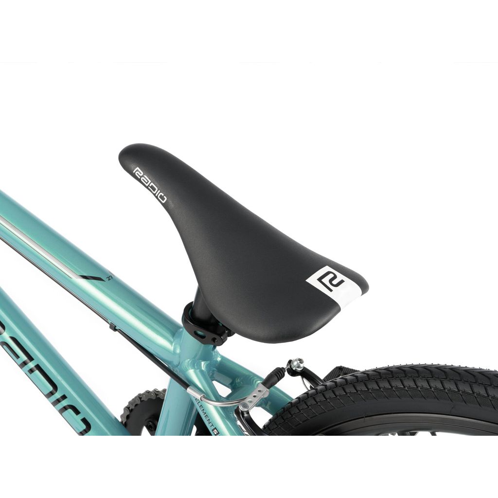 Close-up of a black bicycle seat mounted on a teal Radio Cobalt Expert Bike frame with tire partially visible.