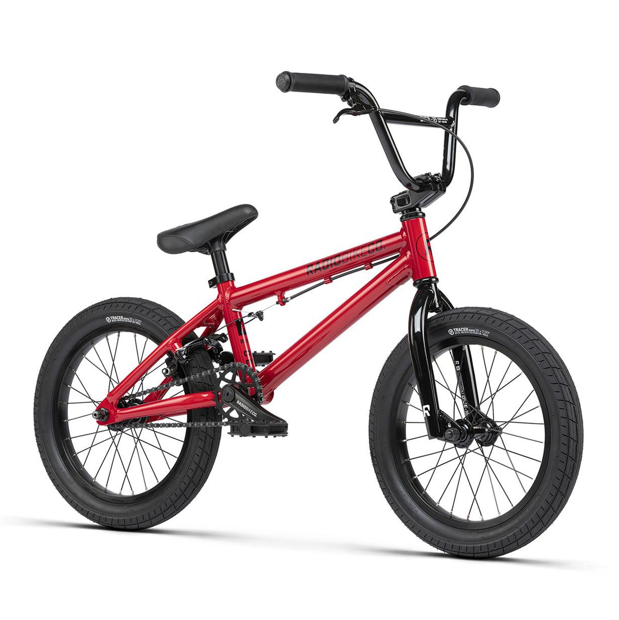 A red Radio Dice 16 Inch Bike with black handlebars, seat, and Salt Traction Tyres. It features a sturdy 6061 Alloy frame and thick, knobby tires designed for off-road and trick riding.
