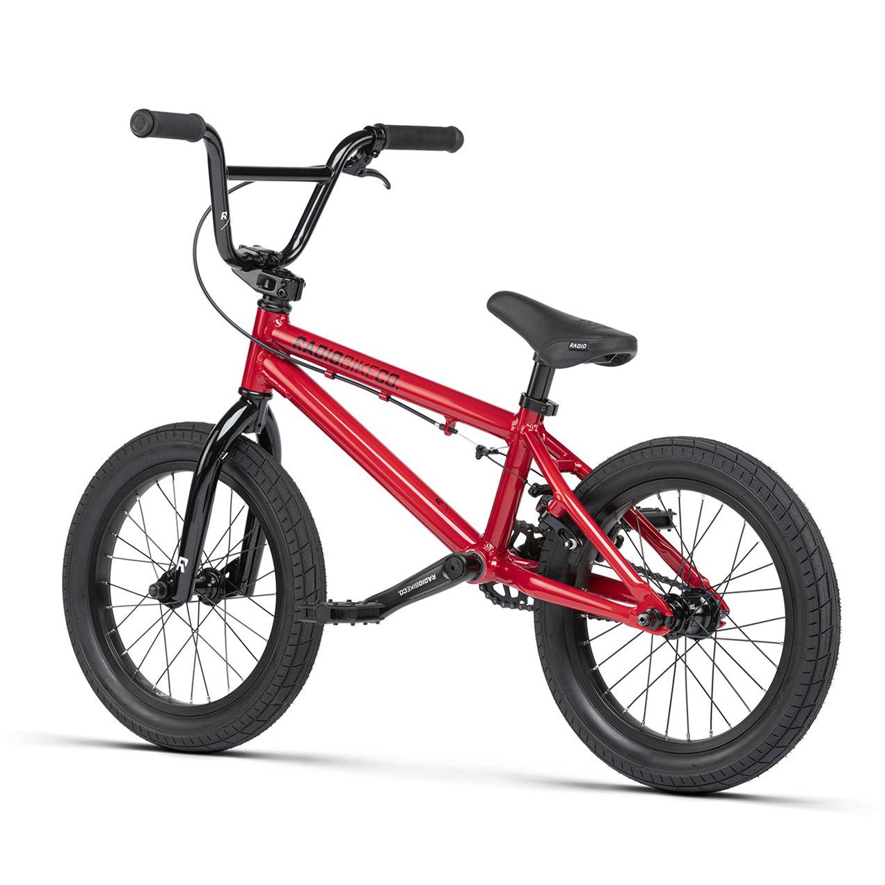 A red BMX bike with black handlebars, seat, and Salt Traction Tyres. The 6061 Alloy frame is rigid and designed with small wheels for tricks and stunts. Known as the Radio Dice 16 Inch Bike, it's perfect for stunting enthusiasts.