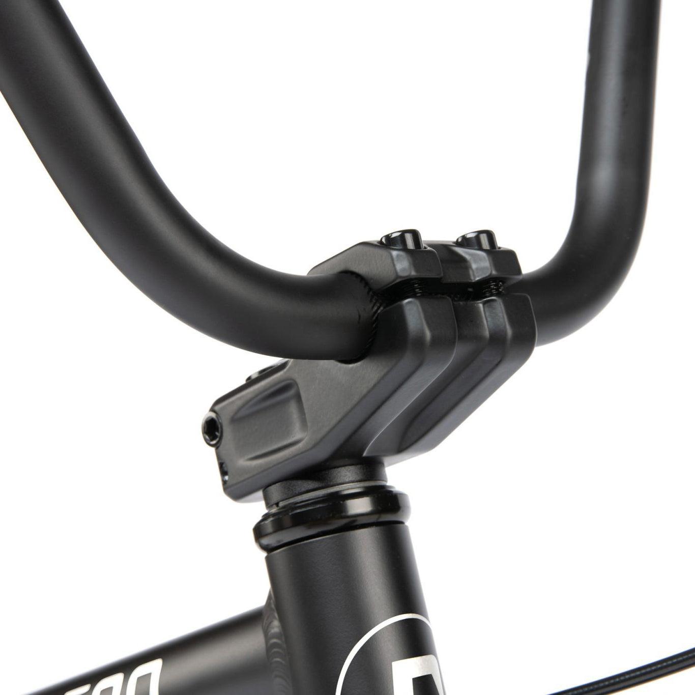 Close-up of a black Radio Dice 20 Inch Bike's handlebars and stem, showcasing a sleek design and secure assembly with bolts.
