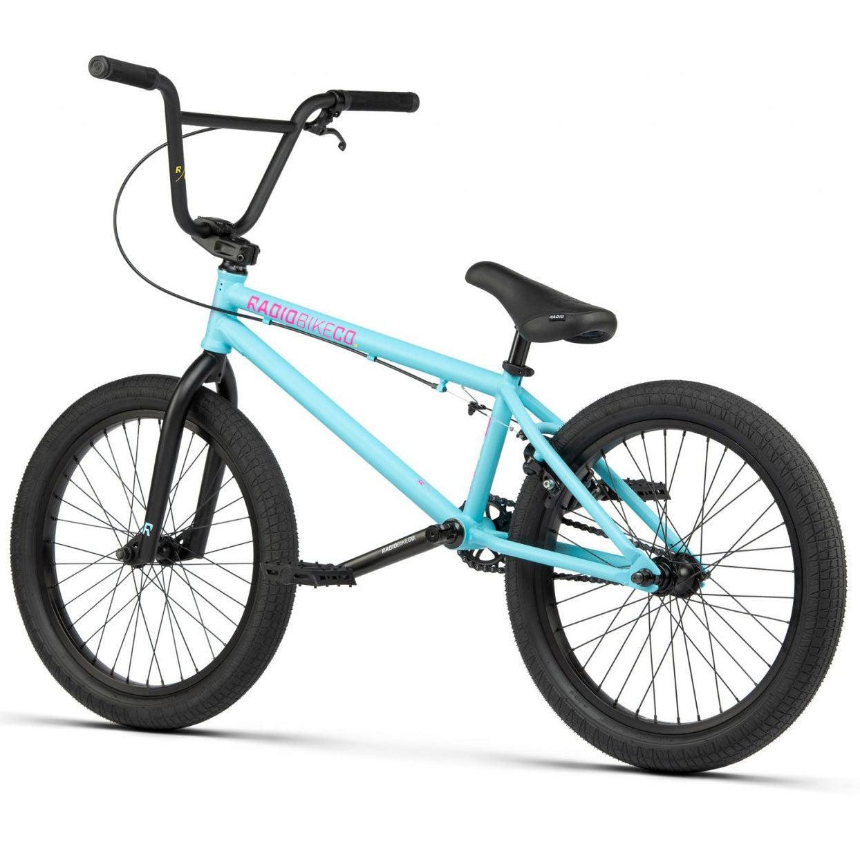 The Radio Evol 20 Inch Bike features a blue frame with black handlebars, seat, and tires, accented by a pink "Radio Bike Co" logo. This bike is perfect for beginner riders and comes equipped with high-quality parts to ensure durability and top performance.