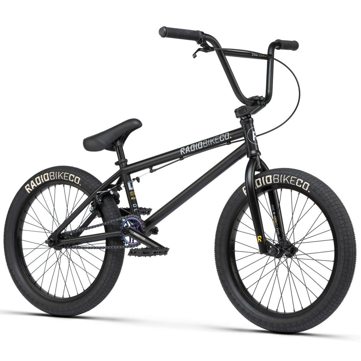 The Radio Evol 20 Inch Bike is a black BMX bike featuring a "RADIOBIKECO" logo on the frame and tires. It comes with a straight top tube, padded seat, and large knobby tires. This high-quality bike includes front and rear brakes, making it perfect for beginner riders.