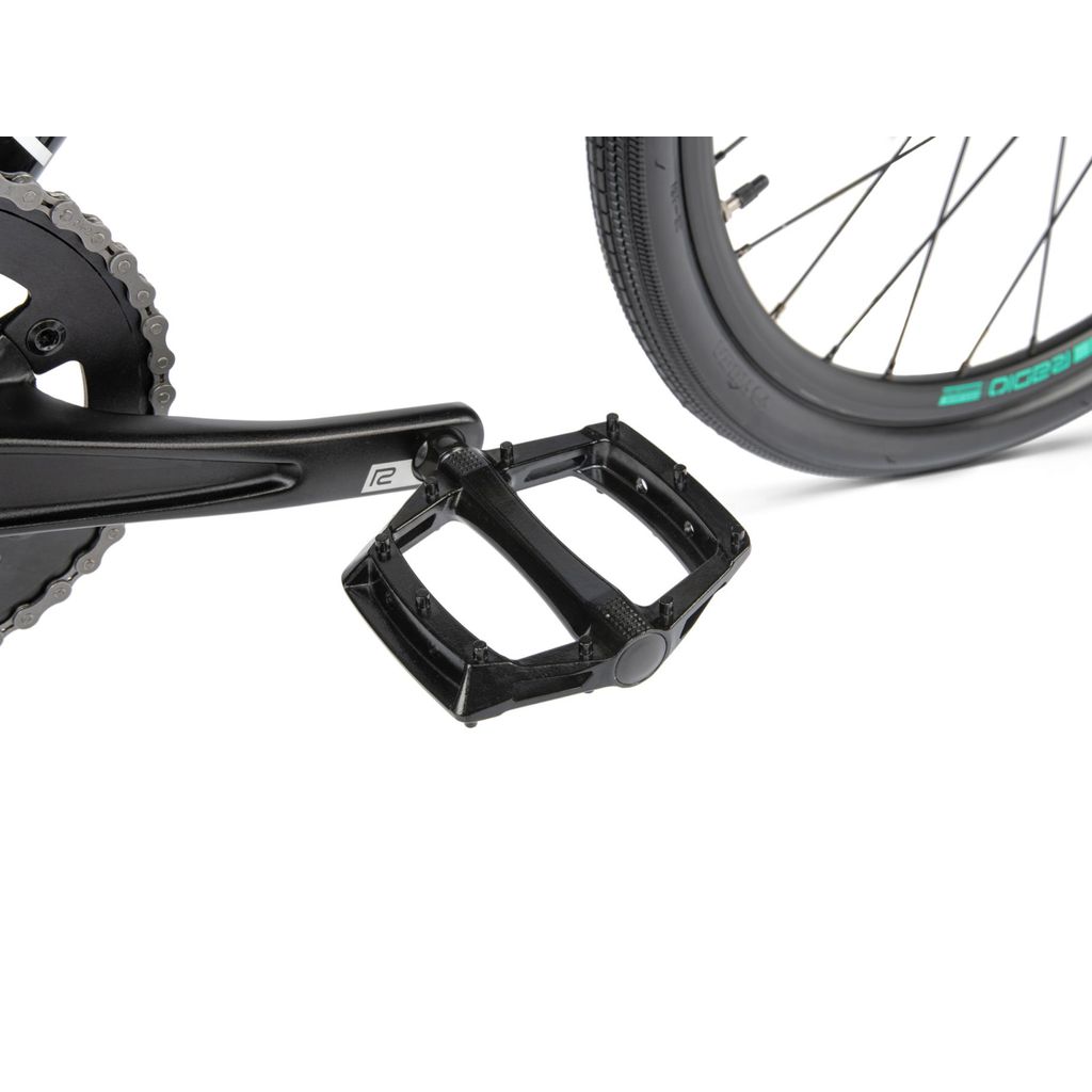 A Radio Xenon Expert Bike pedal and a bicycle tire.