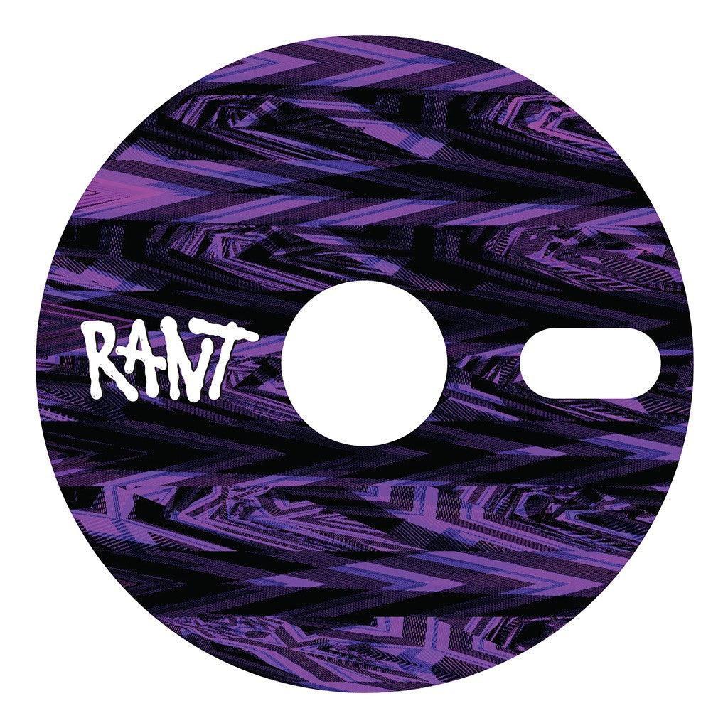 Round bicycle sprocket with a purple and black geometric pattern, labeled "Rant Stick Em" in white.