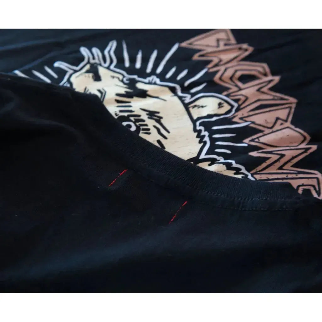 Close-up of the Backbone Ratty BMX Kids T-Shirt in black, featuring visible red neckline stitching and a partial bear graphic with bold text—ideal for young Backbone BMX fans.