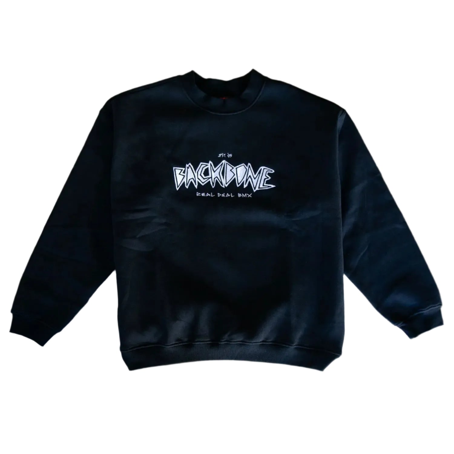 The Backbone Real Deal Crewneck features "BACKBONE REAL DEAL BMX" in white graffiti-style text on the front, laid flat on a gray surface—an ideal winter essential.