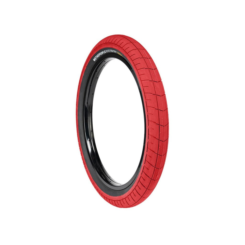 A red Wethepeople Activate Tyre (100 PSI) with puncture protection on a white background.