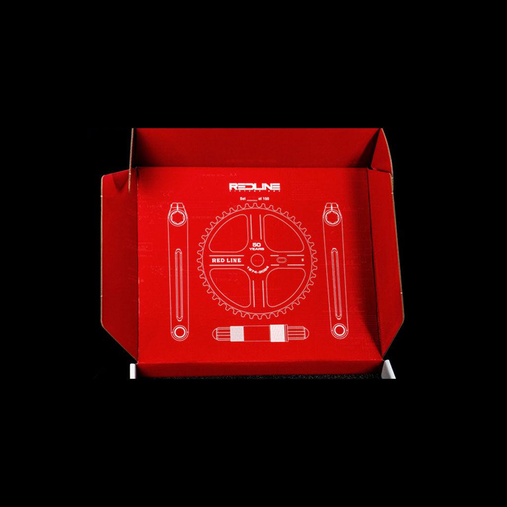 A red box with a white line drawing of a BMX crank set and chainring, labeled "REDLINE," celebrates the REDLINE Flight 401 50th Anniversary Crank Set.