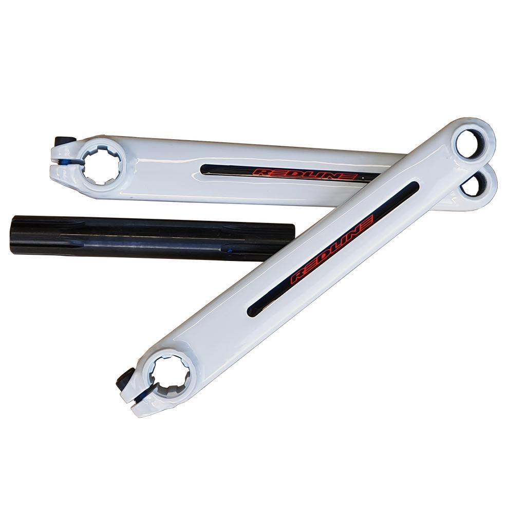 Two white Redline Flight Cranks arms with red and black logos and a black spindle, displayed on a black background.