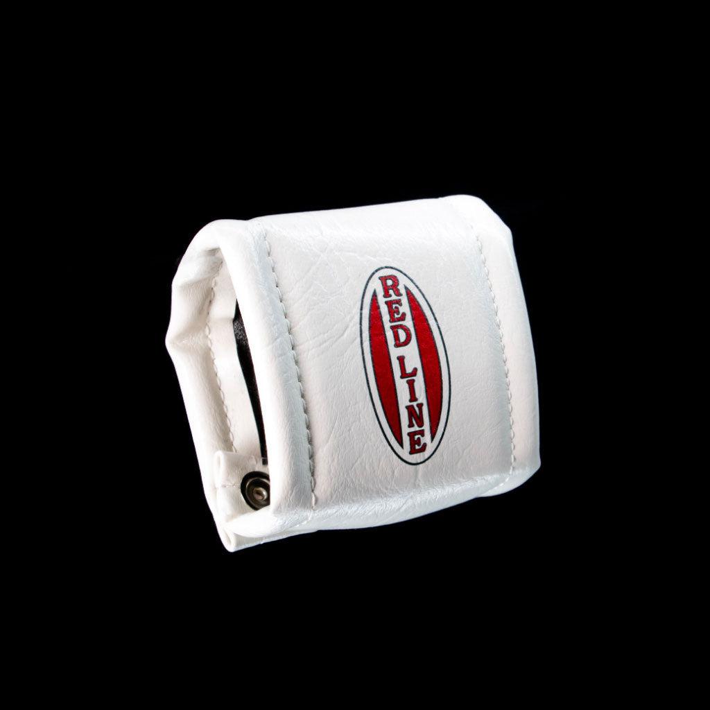 A compact, white leather pouch featuring a red and black "Redline Proline" logo on the front, all set against a sleek black background.