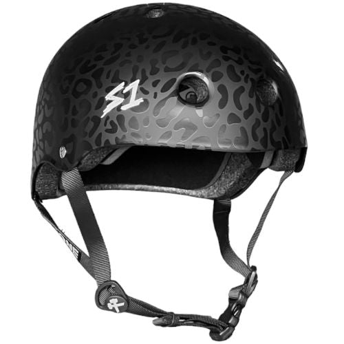 A black skateboard helmet with a leopard print design, the S1 logo on the side, adjustable straps, and multiple ventilation holes. The S-One Helmet Lifer Black Leopard is a multi-impact helmet that's also Australian-certified for safety.
