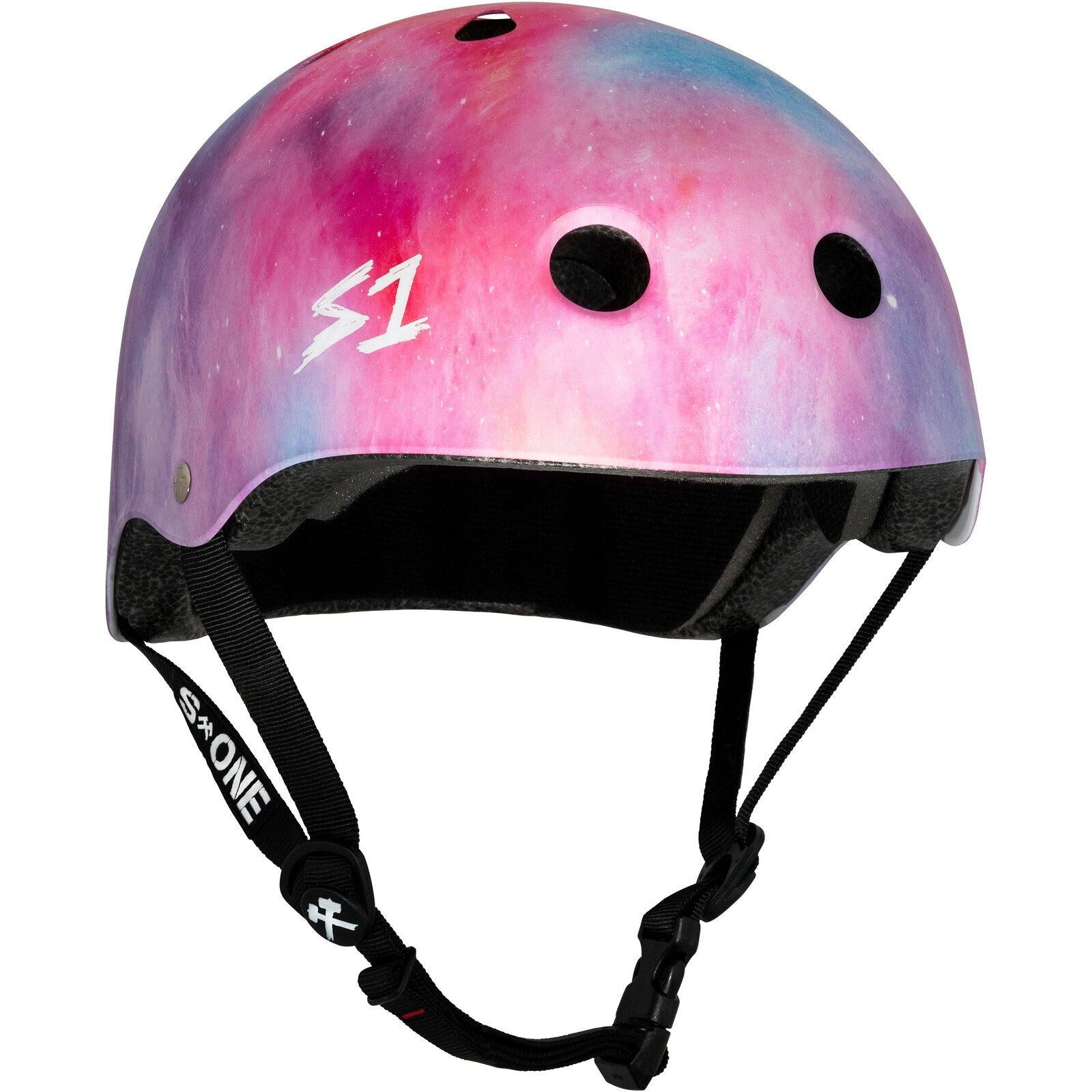 A pink and purple gradient S-One Helmet Lifer Cotton Candy with a white "S1" logo, featuring air vents and an adjustable black chin strap. This multi-impact helmet combines style and safety for any skateboarding adventure.